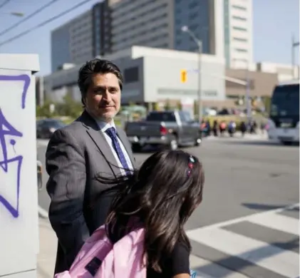  ?? CARLOS OSORIO/TORONTO STAR ?? Pierre Laporte Middle School principal Paolo Peloso has been helping monitor before- and after-school traffic at Wilson Ave. and Julian Rd.