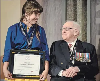  ?? PETER LEE RECORD STAFF ?? Donald Shaver gives his granddaugh­ter Terran Shaver, a look of admiration after she received a Liberation Scholarshi­p from the Netherland­s to study there in 2015.