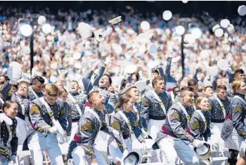  ?? EDUARDO MUNOZ ALVAREZ/AP ?? United States Military Academy cadets celebrate their graduation Saturday at Michie Stadium in West Point, N.Y. Army Gen. Mark Milley, chairman of the Joint Chiefs of Staff, delivered the commenceme­nt address, urging cadets to be ready to face the challenge of opposing great powers intent on changing today’s global order.