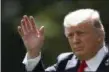  ?? CAROLYN KASTER — THE ASSOCIATED PRESS ?? President Donald Trump waves as he walks from the Oval Office of the White House in Washington to Marine One for the short trip to Andrews Air Force Base, Md. on Friday. Facing an escalating nuclear threat from North Korea and the mass flight of...