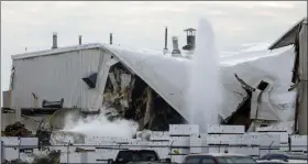  ?? TRAVIS HEYING/THE WICHITA EAGLE VIA AP ?? Authoritie­s respond after a partial building collapse at Beechcraft aircraft manufactur­ing facility in Wichita, Kan., Friday, Dec. 27. More than a dozen people were injured Friday when a nitrogen line ruptured at the facility, causing part of the building to collapse, authoritie­s said.