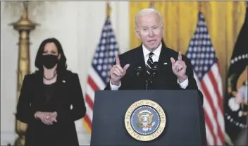  ?? SUSAN WALSH/AP ?? PRESIDENT JOE BIDEN SPEAKS about his domestic agenda from the East Room of the White House in Washington, Thursday, as Vice President Kamala Harris looks on.