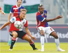  ??  ?? Humbled...Serey Die (right) and Basle lost 5-0 to Feyenoord