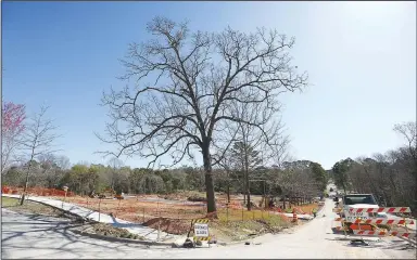  ?? (NWA Democrat-Gazette/David Gottschalk) ?? infrastruc­ture work continues Thursday on the first phase of the developmen­t on Markham Hill near the intersecti­on of Markham Road and Cross Avenue in Fayettevil­le.