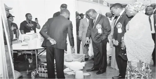  ?? PHOTO: STATE HOUSE ?? President Goodluck Jonathan (3rd right) inspecting an exhibition stand during the launch of Youth Empowermen­t in Agricultur­e Programme (YEAP) and Fund for Agricultur­al Finance in Nigeria, in Abuja yesterday. With him are (from right) Minister of State...