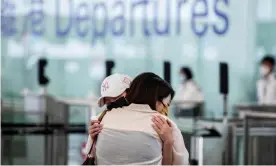  ?? From Hong Kong airport. Photograph: Isaac Lawrence/AFP/Getty Images ?? Friends embrace at the departure gates before one of the twice-daily flights to London