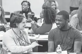  ??  ?? Peer Power success coaches Jasmine Sullivan, left, and Juwon Salami get to know each other during the first training meeting July 8 at E.C. Ball Hall at the University of Memphis. After the training, success coaches will work with students in classrooms at Shelby County Schools. BRAD VEST/THE COMMERCIAL APPEAL