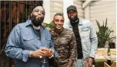  ??  ?? Rick Ross, Marcus Samuelsson and Dwyane Wade at Red Rooster Overtown.