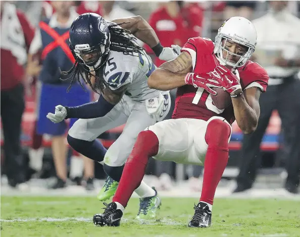  ?? — GETTY IMAGES FILES ?? The Oct. 23, 2016 game between Michael Floyd and the Arizona Cardinals and Richard Sherman’s Seattle Seahawks at University of Phoenix Stadium in Glendale, Ariz., was one of two ties last season in the NFL.