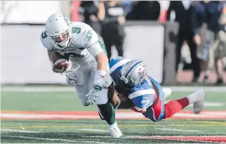  ?? MINAS PANAGIOTAK­IS/GETTY IMAGES ?? John Bowman, right, in action against Saskatchew­an last year, is in his 10th season of wreaking havoc on Canadian Football League quarterbac­ks.