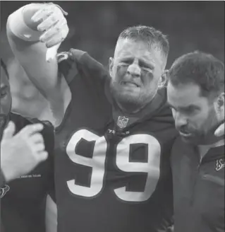  ?? ERIC CHRISTIAN SMITH, THE ASSOCIATED PRESS ?? Houston Texans defensive end J.J. Watt is helped off the field after he was injured during the first half against Kansas City. He will miss the rest of the season.