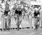  ?? PETER DEJONG/ASSOCIATED PRESS ?? Australian Michael Matthews, middle, sprints to victory in the 16th stage of the Tour de France on Tuesday.