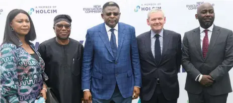  ?? ?? Cross River State Governor, Bassey Otu ( middle); Executive Director, Lafarge Africa Plc, Elendagiwa- Amu ( left); Chairman, Adebode Adefioye; ; Area Manager, Middle East & Africa, Holcim, Grant Earnshaw, and Group Managing Director/ Chief Executive Officer ( CEO), Lafarge Africa Plc, Lolu Alade- Akinyemi during the commission­ing of the 20km evacuation road at Mfamosing, Cross River State.