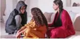  ??  ?? This image grab taken from a handout video released by the Doha Film Institute shows Qatari film director Amal Al-Muftah (left) speaking with actresses on-set during the filming of a short film at an undisclose­d location. —AFP photos