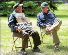  ?? PETE BANNAN — DIGITAL FIRST MEDIA ?? Jack O’Brien of East Goshen and David Walsh of Malvern were among the more than 100 people who attended a lunchtime service at Rose Tree Park for National Day of Prayer.