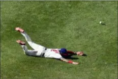  ?? DERIK HAMILTON — THE ASSOCIATED PRESS ?? The Phillies’ J.P. Crawford dives but is unable to make a catch on a ball off the bat of the Marlins’ JT Riddle during the seventh inning of Sundays game in Philadelph­ia. The Marlins won 6-4.