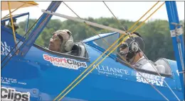  ?? STAFF PHOTO BY PAUL LAGASSE ?? Maybelle Campbell, left, a 96-year-old veteran of World War II, went for a ride in a vintage Army Air Force trainer last Thursday at the Maryland Airport.