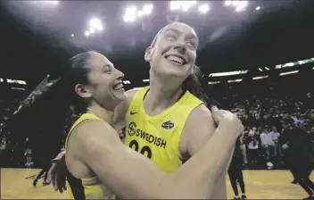  ?? ASSOCIATED PRESS ?? THIS SEPT. 4, 2018, FILE PHOTO shows Seattle Storm’s Sue Bird, left, and Breanna Stewart embracing after the Storm defeated the Phoenix Mercury during Game 5 of a WNBA basketball playoff semifinal, in Seattle.