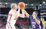  ?? [PHOTO BY BRYAN TERRY, THE OKLAHOMAN] ?? Oklahoma’s Brady Manek, left, looks to shoot beside TCU’s Alex Robinson during Saturday’s game at Lloyd Noble Center.