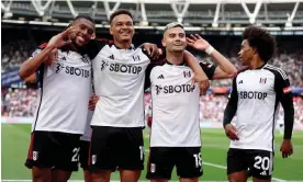  ?? Photograph: Richard Pelham/Getty Images ?? Andreas Pereira (second right) celebrates with Alex Iwobi (left), Rodrigo Muniz and Willian (right).