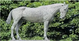  ?? Pictures: JONATHAN BUCKMASTER ?? A rider in First World War cavalry uniform in front of the memorial unveiled at Ascot yesterday. It was created by sculptor Susan Leyland, pictured yesterday, inset