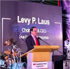  ??  ?? LGC FOUNDER. Laus Group of Companies Chairman and CEO Levy P. Laus shares his message to guests and customers during the Carworld Fuso’s formal launching and blessing