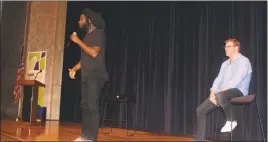  ?? STAFF PHOTOS BY TIFFANY WATSON ?? Jason Reynolds and Brendan Kiely, authors of “All American Boys,” talk with students at a public forum Sept. 28 at St. Charles High School in Waldorf.