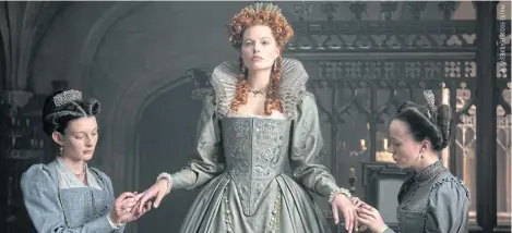  ??  ?? From left, Grace Molony as Dorothy Stafford, Margot Robbie as Queen Elizabeth I and Georgia Burnell as Kate Carey in a scene from Mary Queen Of Scots.