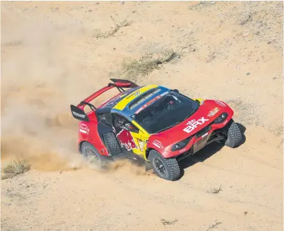  ?? Picture: AFP ?? CLOSING IN. French driver Sebastien Loeb of Bahrain Red Extreme continued to make up time on the leaders after the 10th stage of the Dakar Rally yesterday.