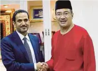  ?? PIC BY FARIZ ISWADI ISMAIL ?? Datuk Seri Hishammudd­in Hussein (right) receiving a courtesy call from UAE ambassador to Malaysia Khalid Ghanim Mohammad Al-Ghaith in Kuala Lumpur yesterday.