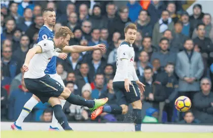  ?? Picture / AP ?? Harry Kane drills home the opener for Spurs against Everton yesterday.