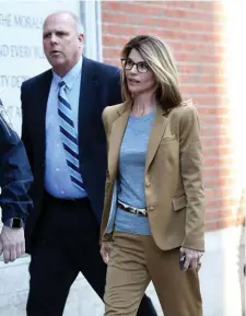  ?? NANCY LANE / HERALD STAFF FILE ?? HAVE MERCY? Actress Lori Loughlin walks into Joseph J. Moakley Federal Court in the Seaport to be arraigned on charges in a college admission scandal on April 3, 2019. Today she is expected to plead guilty and accept jail time and fines in a plea deal arranged with federal prosecutor­s.