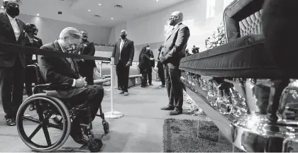  ?? David J. Phillip / Associated Press file photo ?? Gov. Greg Abbott attends the June 2020 visitation for George Floyd at the Fountain of Praise church in Houston. A Minneapoli­s police officer killed the former Third Ward resident died May 25, 2020.