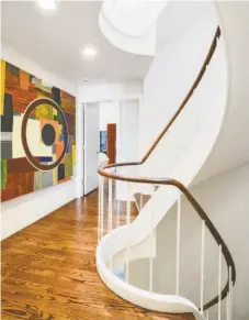  ?? PHOTOS BY DANIEL LUNGHI PHOTOGRAPH­Y ?? Above left: Built-ins flank the great room’s fireplace, and the room is accessed by both an elevator and the home’s spiral staircase. Above right: The spiral staircase connects all five levels of the Telegraph Hill residence at 1400-1404 Montgomery St. The main home features four bedrooms and there is a two-bedroom apartment.