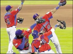  ?? ALAN DIAZ / ASSOCIATED PRESS ?? Dominican Republic players celebrate a victory en route to the 2013 WBC title. The nation starts this year’s tournament Thursday in Miami.