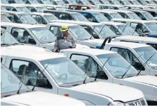  ?? /Reuters ?? Export
heavy: A worker inspects cars at Nissan’s manufactur­ing plant in Rosslyn, Pretoria.