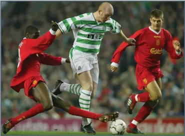  ?? Picture: Getty ?? Steven Gerrard (right) takes on SportTimes columnist John Hartson in 2003