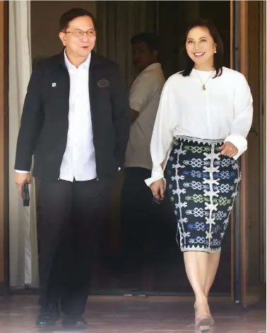  ??  ?? STRANGE BEDFELLOWS – Vice President Leni Robredo (right) emerges from her first meeting presiding over the Inter-Agency Committee on Anti-Illegal Drugs (ICAD) with co-chairperso­n Philippine Drug Enforcemen­t Agency (PDEA) Director-General Aaron Aquino (left) at the Office of the Vice President in Quezon City, Friday. (Mark Balmores)