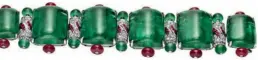  ??  ?? High Jewellery Diva bracelet in white gold with emeralds, rubies, and diamonds, Bulgari