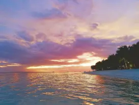  ??  ?? Purple and orange sunset at the Bohol Beach Club