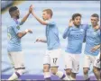  ?? MICHAEL REGAN - THE ASSOCIATED PRESS ?? Manchester City players celebrate after scoring their second goal during the English Premier League soccer match between Manchester City and Newcastle at the Ethiad Stadium in Manchester, England, Wednesday, July 8, 2020.