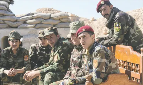 ?? RYAN REMIORZ / THE CANADIAN PRESS FILES ?? Peshmerga fighters, some of whom are shown in 2017, did the lion’s share of work to defeat ISIS, Joe Roberts writes.