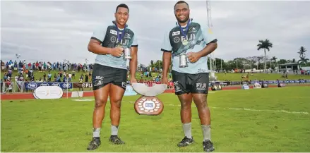  ?? Photo: NRC ?? Fiji Airways Fijian Drua props (from left) Eroni Mawi and Luke Tagi after winning the 2018 National Rugby Championsh­ip at Churchill Park, Lautoka.