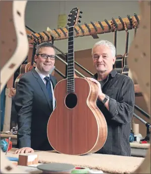  ??  ?? WhiteRock Capital Partners senior investment manager David McCurley and George Lowden, owner of Lowden Guitars.