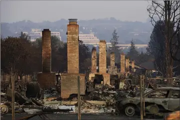  ?? JAE C. HONG — THE ASSOCIATED PRESS FILE ?? A row of chimneys stand in a neighborho­od devastated by the Tubbs fire near Santa Rosa.