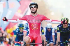  ?? — AFP photo ?? Cofidis’ French cyclist Nacer Bouhanni celebrates as he crosses the finish line winning the fourth stage of the 97th Volta Catalunya 2017, a 194,3 km ride from Llivia to Igualada on March 23, 2017.