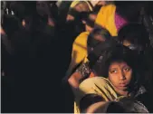  ?? AP ?? Rohingya women and girls wait for relief aid at the Balukhali refugee camp, near Cox’s Bazar, in Bangladesh on Saturday