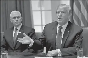  ?? AP/SUSAN WALSH ?? President Donald Trump (right) speaks Monday in the Cabinet Room of the White House in Washington at the start of a meeting with military leaders. Vice President Mike Pence is at left.
