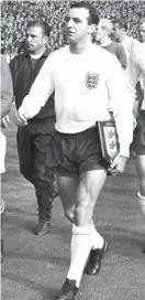  ??  ?? FILE - This is a Oct. 23, 1963 file photo of England captain Jimmy Armfield, leading out England for the match against the Rest of the World led by Alfredo Di Stefan for the Football Associatio­n Centenary soccer match at Wembley Stadium Photo: AP