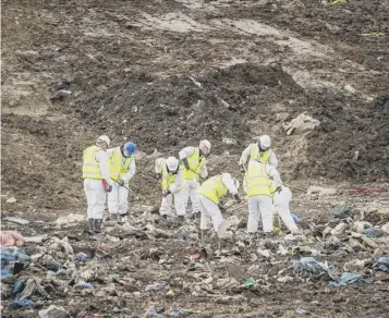  ??  ?? 0 Police search landfill for Corrie Mckeague. His mother Nicola Urquhart said the remains found were not of her son